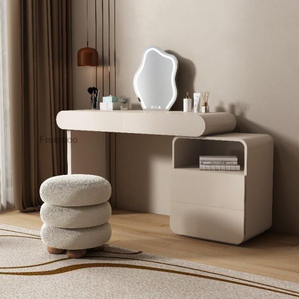 a white table with a mirror, stool and other items on it in a room