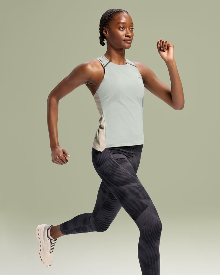 Ultralight, quick-drying, breathable. When the competition (and temperature) is hot, that’s when this running tank comes into its own. The last things you want to feel from your running apparel are hard points and distracting details. That's why we made this Performance Tank taped and seamless, so it feels pretty much like nothing. But, has a performance look that shows you mean business. You may be fast, but this quick-drying top may be faster. Lightweight On DryTec™ technology fabrics wick swe Sporty Moisture-wicking Top For Running Errands, Moisture-wicking Athleisure Tops For Errands, Compression Racerback Tank Top For Running, Compressive Running Activewear, Sporty Moisture-wicking Activewear, Functional Athletic Activewear For Running, Functional Athletic Fit Activewear For Running, Functional Running Tank Top With Mesh Back, Functional Mesh Back Tank Top For Running