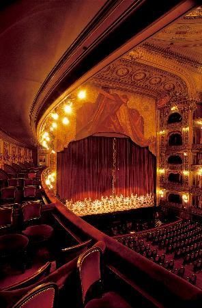 an auditorium with rows of seats and lights