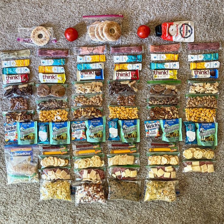 a variety of snacks laid out on the floor