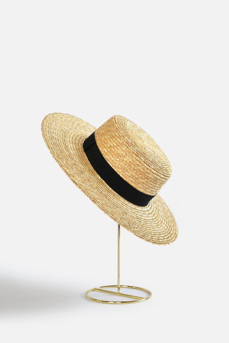 Bring classically chic flair to your summer look with the Abella Classic French Boater Hat. This classic French accessory is made from breathable straw and designed with an adjustable pull string for the perfect fit. You'll love the elegant aesthetic this piece adds to any ensemble. Head circumference: 55.5cm (designed with adjustable pull string for the perfect fit) Your purchase can also be made at: www.enbelleepoque.com Chic Adjustable Sun Hat For Kentucky Derby, Classic Brimmed Straw Hat For Beach Season, Classic Adjustable Summer Sun Hat, Classic Summer Beach Sun Hat, Classic Brimmed Boater Hat For Beach, Classic Woven Sun Hat For Beach, Classic Adjustable Straw Hat For Beach, Classic Adjustable Straw Hat, Classic Summer Boater Hat For Beach