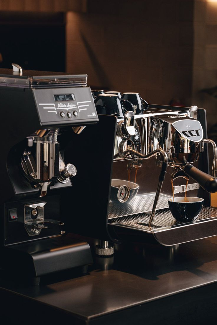 an espresso machine sitting on top of a counter