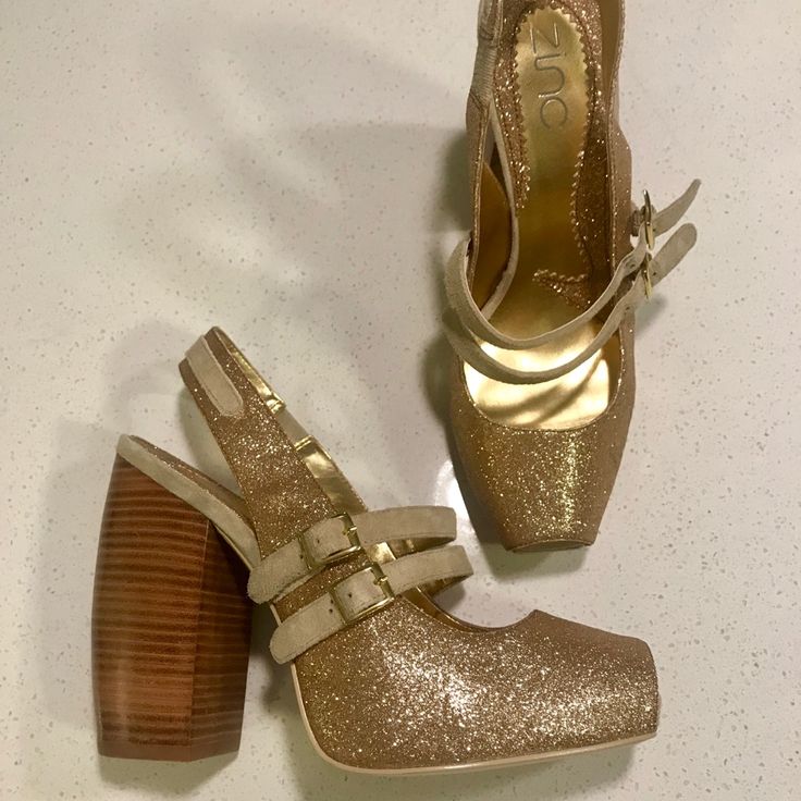 Be The Life Of The Party With These Gorgeous Sparkly Gold Glitter Wood Chunk Heel. With A Teaser Peep Toe And A Double Side Buckle These Won’t Be Coming Off On The Dance Floor. Look Amazing With Dark Denim And A White Tee! Never Worn, Originally $89 Chic Pointed Toe Heels With Glitter Accents, Festive Summer Heels High Heel, Holiday Formal Heels With Glitter Accents, Formal Holiday Heels With Glitter Accents, Festive Summer High Heels, Glamorous Closed Toe Heels With Glitter Accents, Shimmer Closed Toe Heels For Evening, Glitter Accented Heels For Formal Parties, Glamorous Gold Heels With Glitter Accents