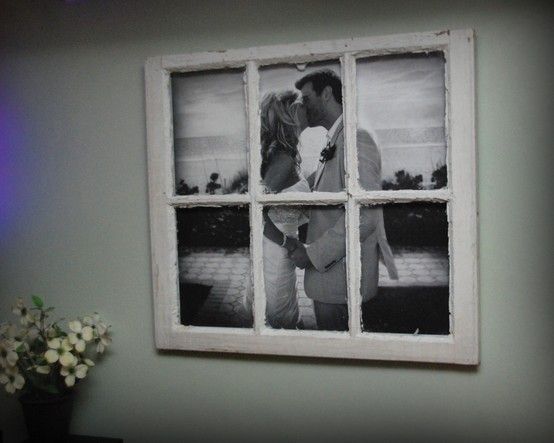 an image of a couple kissing in front of a window with the caption easy home ideas large photo in an old window pane