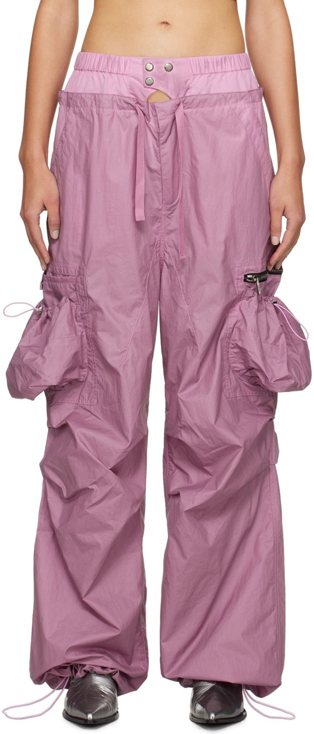 Nylon taffeta cargo pants. · Paneled construction · Cutout at elasticized waistband · Drawstring at layered waistband · Two-pocket styling · Zip-fly · Bungee-style drawstring at cuffs · Zip and patch pockets at outseam · Flap pocket at back Supplier color: Dusty pink Nylon Cargo Pants With Functional Drawstring, Utility Nylon Parachute Pants With Drawstring, Utility Nylon Cargo Pants With Functional Drawstring, Nylon Techwear Parachute Pants With Functional Drawstring, Utility Nylon Parachute Pants With Cargo Pockets, Spring Nylon Parachute Pants With Cargo Pockets, Spring Nylon Cargo Pants With Multiple Pockets, Spring Parachute Pants With Cargo Pockets, Utility Parachute Pants With Functional Drawstring