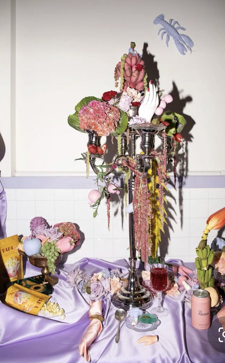 a table topped with lots of different types of flowers