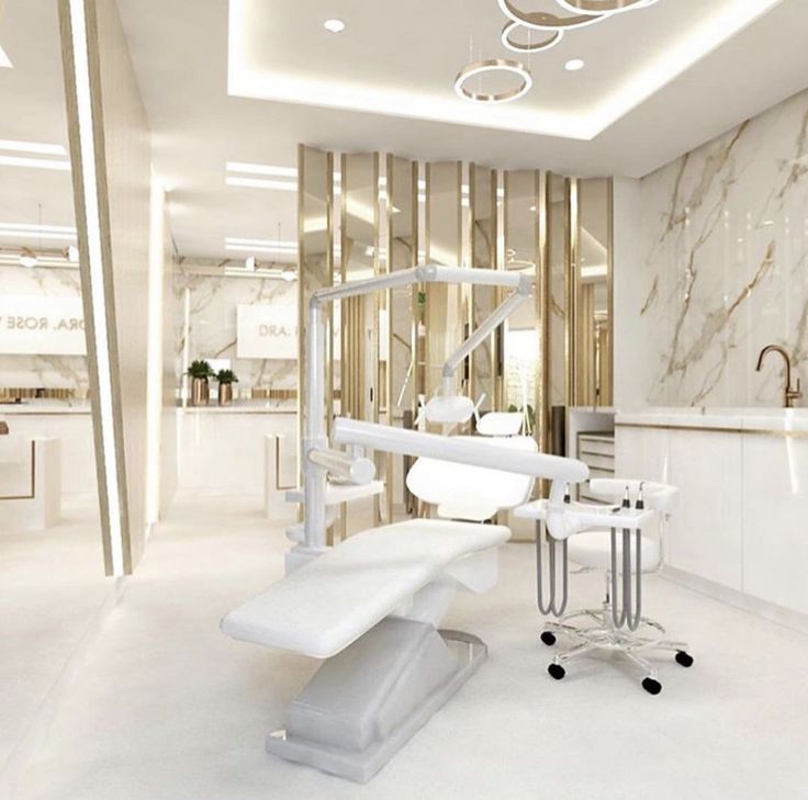 a dental office with marble walls and white furniture