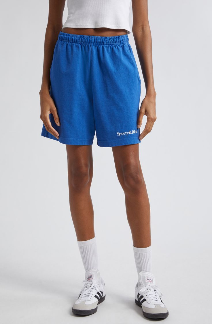 Look sleek in workout mode wearing these sporty cotton shorts cut in a high-waist silhouette and stamped with logo branding at the hip. 5 1/2" inseam; 24" leg opening; 13" front rise; 16 1/2" back rise (size Medium) Elastic waist Front slant pockets; back patch pocket Machine wash, tumble dry Made in the USA Asian & Pacific Islander Owned/Founded Basic Cotton Activewear With Built-in Shorts, Sporty High-waisted Athletic Shorts With Relaxed Fit, Sporty Cotton Shorts With Short Inseam, Sporty Relaxed Fit Athletic Shorts Mid-thigh, Sporty Mid-thigh Loungewear Shorts, Athleisure Cotton Athletic Shorts With Short Inseam, Cotton Athletic Shorts With Short Inseam For Athleisure, Sporty Short Leg Cotton Bottoms, Sporty Cotton Bottoms With Short Legs