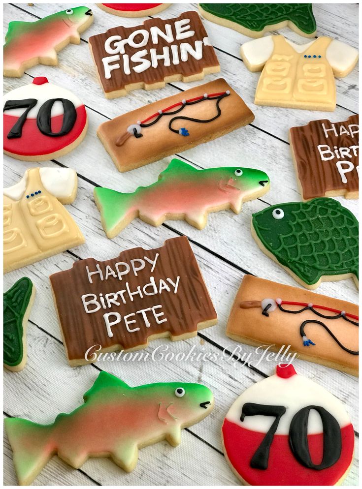 some decorated cookies are on a table with the words gone fishin written in it