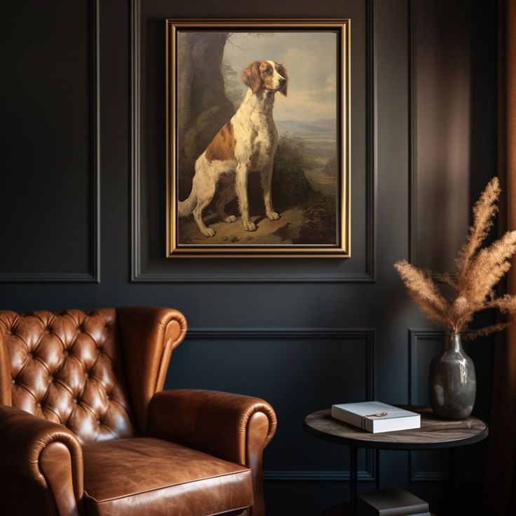 a brown leather chair sitting in front of a painting