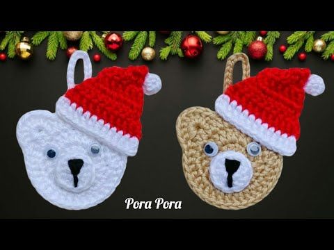 two crocheted christmas ornaments hanging from a tree