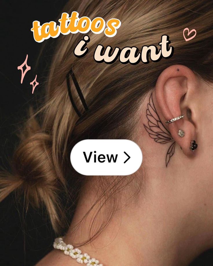 a woman's ear with tattoos on it