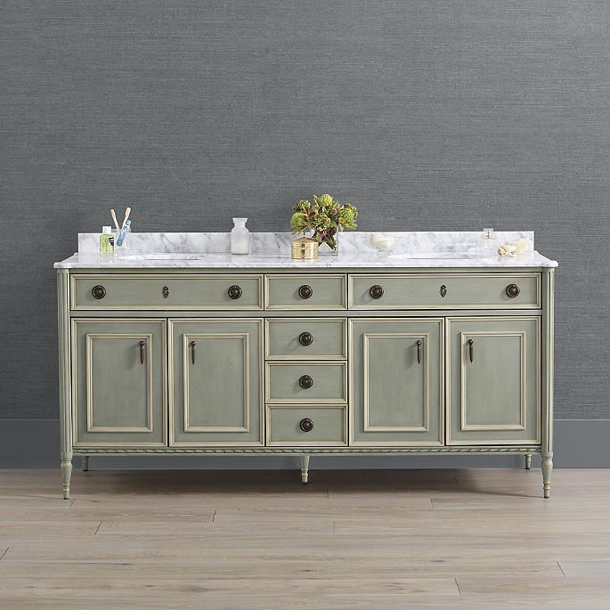 a double sink vanity with marble top and two mirrors on the wall in a bathroom