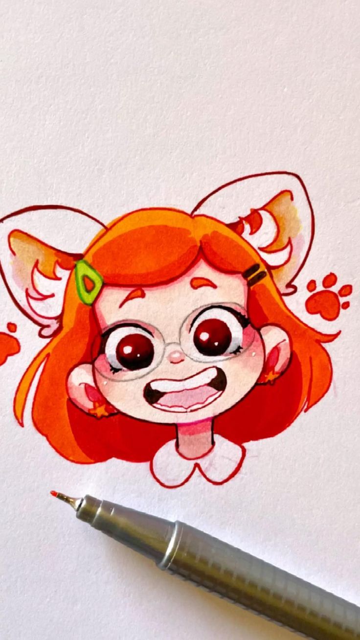 a drawing of a little red haired girl with big eyes and an orange hair is on the paper next to a pen