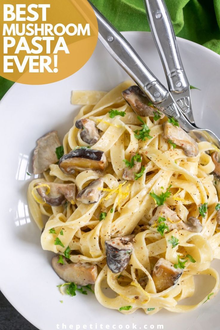 a white plate topped with pasta and mushrooms