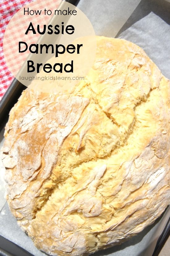 a loaf of bread sitting on top of a pan with the words how to make aussie damper bread