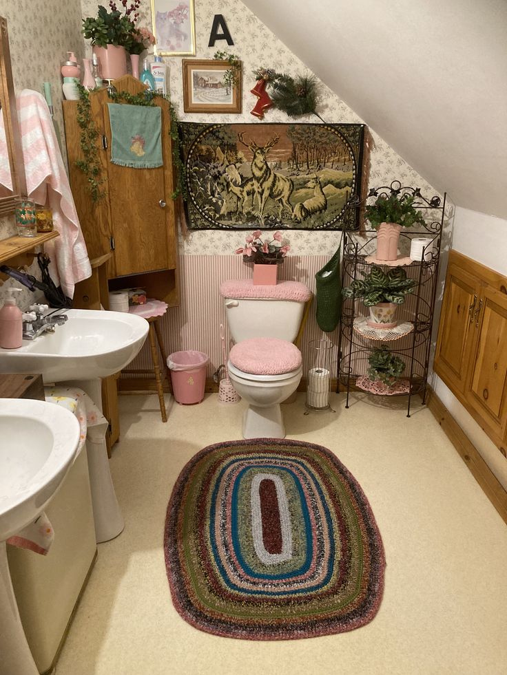 a bathroom with a rug, sink and toilet