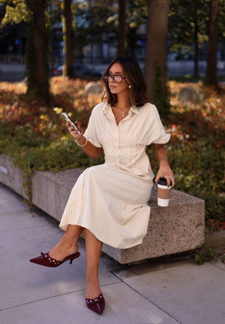 This teacher-inspired dress boasts vertical stripes for a slimming effect, making it an ideal wardrobe choice. The button-down design exudes a classic elegance while the maxi length offers a sophisticated flair. Show off your sense of style with this stylish and flattering dress. Fabric 50% cotton, 50% polyester Classic Striped Shirt Dress For Work, Classic Striped Shirt Dress, Chic Vertical Stripe Shirt Dress, Classic Summer Midi Dress For Day Out, Chic Maxi Dress With Vertical Stripes, Elegant Striped Shirt Dress For Daywear, Elegant Striped Maxi Dress For Daywear, Classic Summer Maxi Dress, Spring Vertical Stripes Shirt Dress For Work