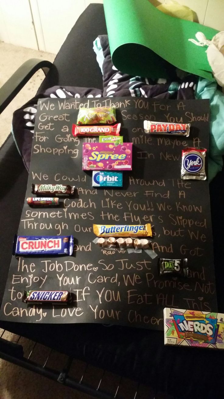 a black table topped with candy and candies on top of it's writing