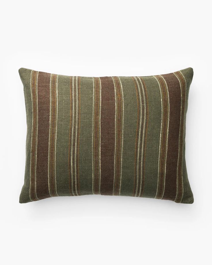 a brown and green striped pillow on a white background