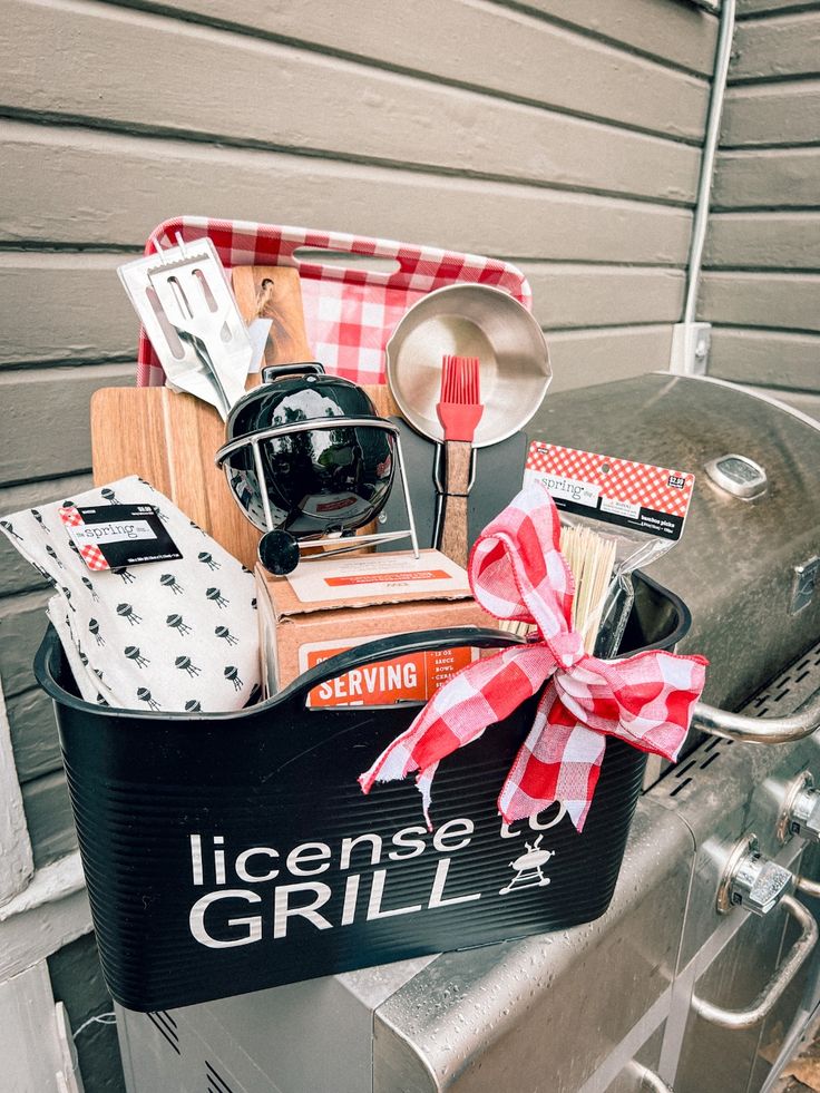 a grilling basket filled with cooking utensils