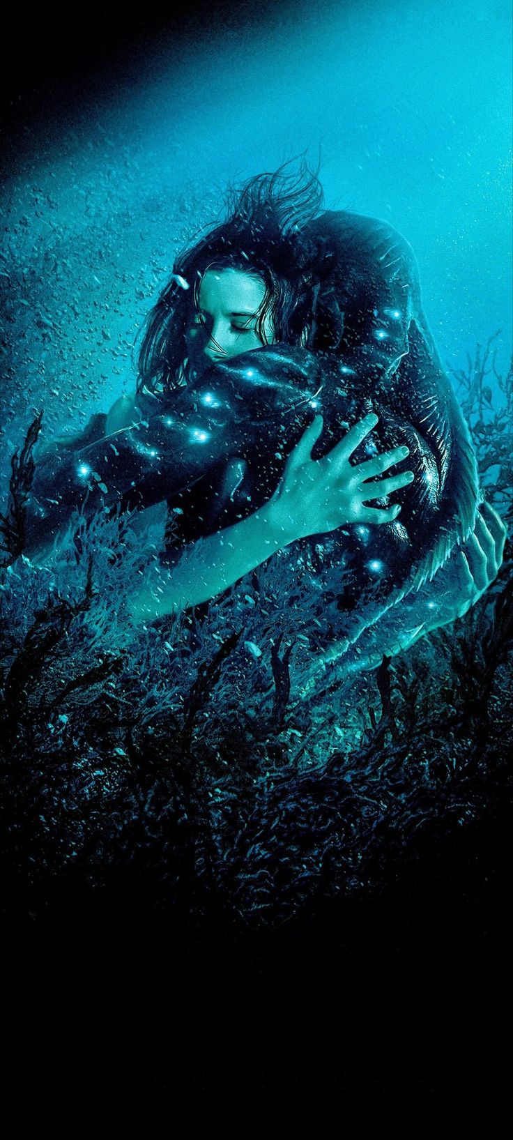 a woman is submerged in the water with her hands on her chest and arms around her body