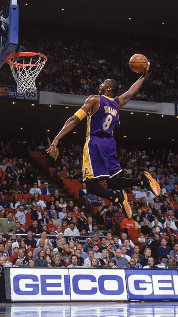 a basketball player jumping in the air to dunk