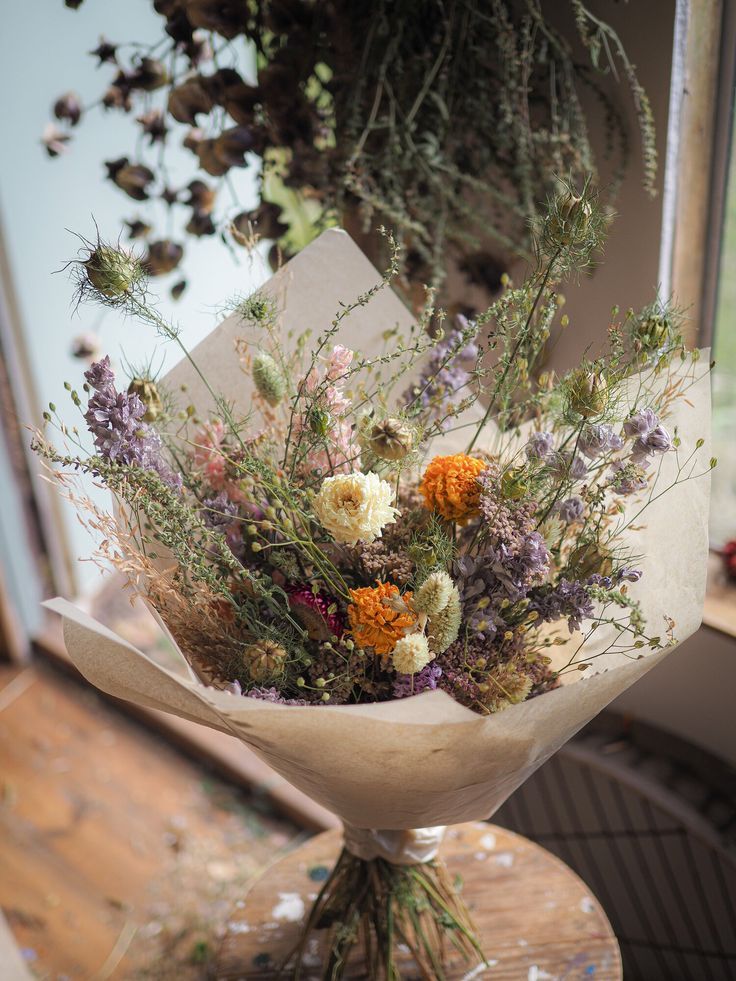 a bouquet of flowers sitting on top of a table