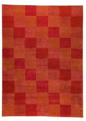 an orange and red rug with squares on it