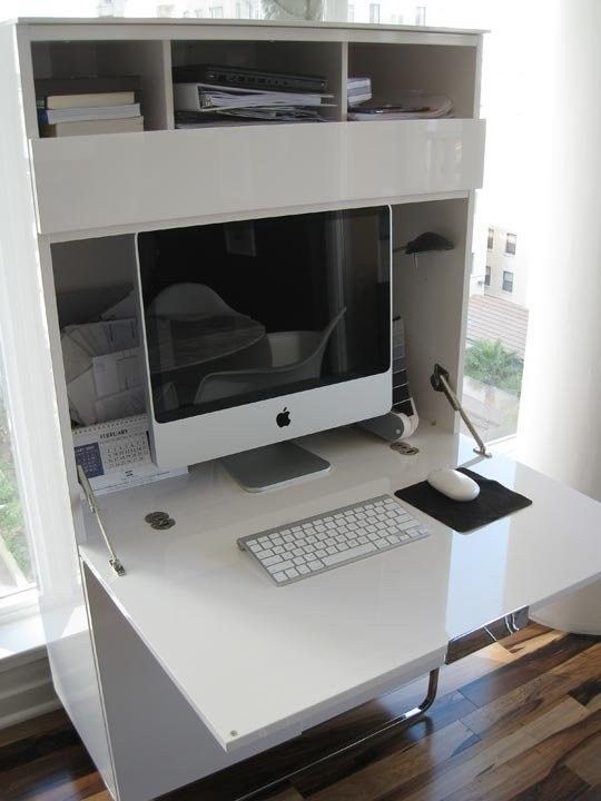 a white desk with a computer on it