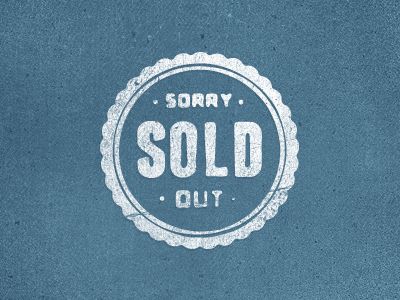 a sold out sign on the side of a blue wall with white lettering that reads sorry sold out