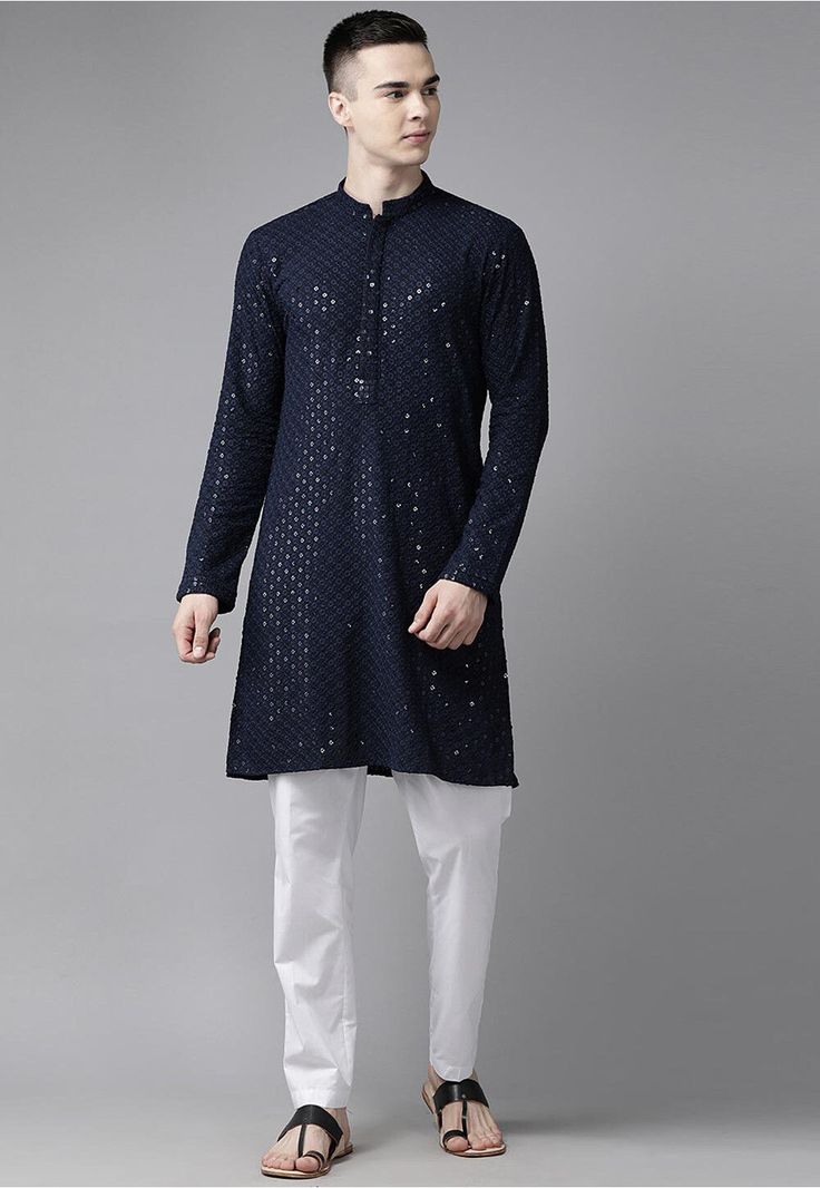 Rayon Kurta in Navy Blue This Readymade Chinese Collar Neck and Full Sleeve attire is Enhanced with Resham and Sequins Work Available with a Poly Cotton Pajama in White Do note: Footwear shown in the image is for presentation purposes only. Half to one inch may vary in measurement. (Slight variation in actual color vs. image is possible) Blue Long Sleeve Kurta With Gota Work, Long Sleeve Traditional Wear With Sequins For Navratri, Blue Long Sleeve Set With Gota Work, Blue Cotton Traditional Wear With Mirror Work, Traditional Blue Sequined Sets, Blue Kurta With Mirror Work For Festivals, Designer Blue Sequin Kurta, Blue Traditional Wear With Sequins, Blue Sequined Traditional Wear With Drape