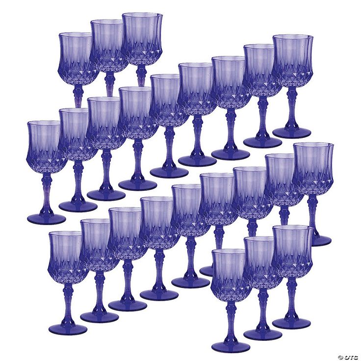 a bunch of wine glasses sitting next to each other on a white surface with no one in the photo