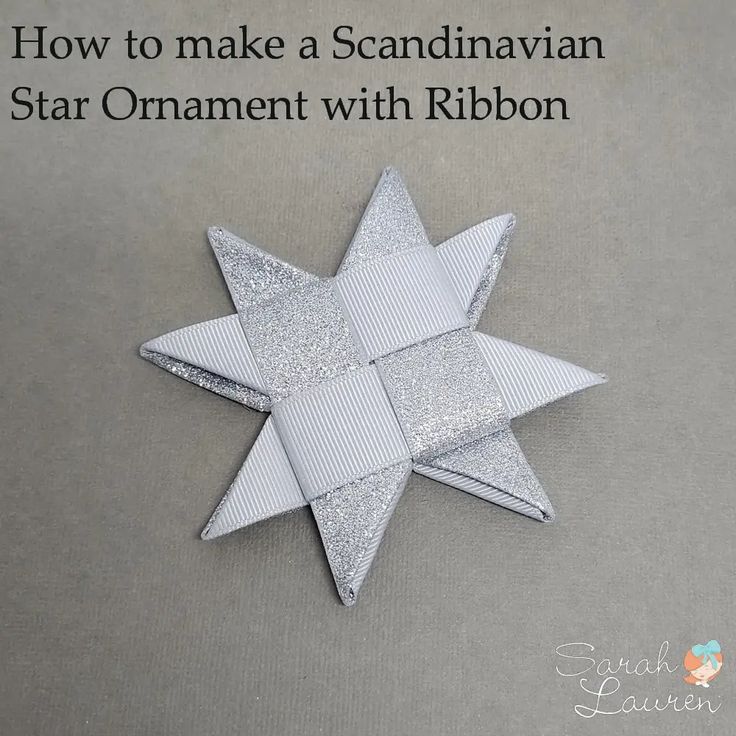 an origami star with ribbon on the bottom and text how to make a scandinavian star ornament with ribbon