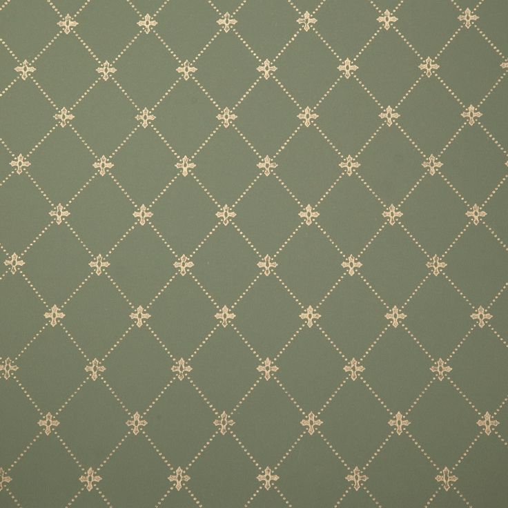 a green and white wallpaper pattern with small squares on it's sides,