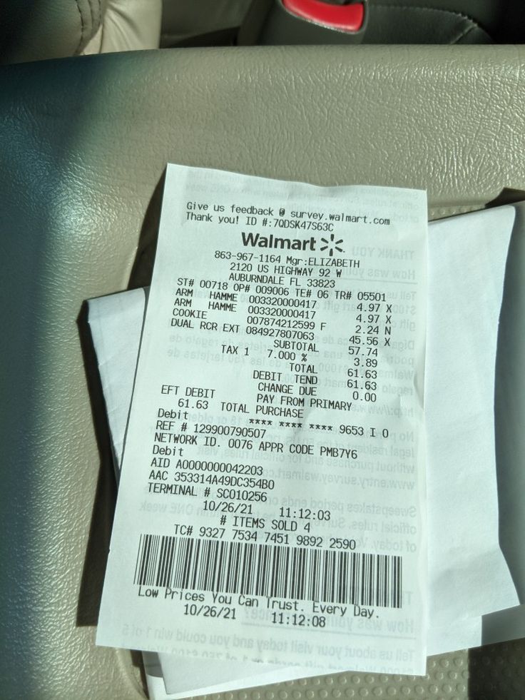 a receipt sitting on the back seat of a car