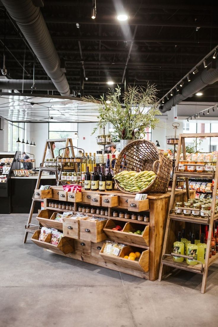 a store filled with lots of different types of food and drink bottles on shelves next to each other