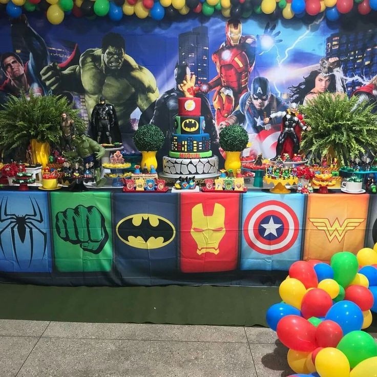 an image of a birthday party with balloons and decorations on the table in front of it