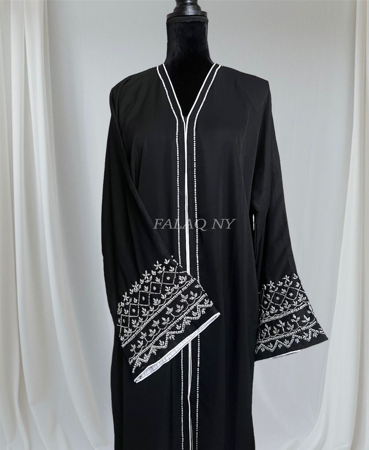 Hand work established black abaya. Perfect for every day wear or any special occasions. Style your abaya as you like it. Modest Black Kaftan For Eid, Long Black Abaya For Eid, Black Long Sleeve Khimar With Dabka, Black Long Thobe For Eid, Black Long Modest Abaya, Traditional Black Long Sleeve Abaya, Traditional Long Sleeve Black Abaya, Traditional Black Long Sleeve Khimar, Black Long Thobe With Dabka