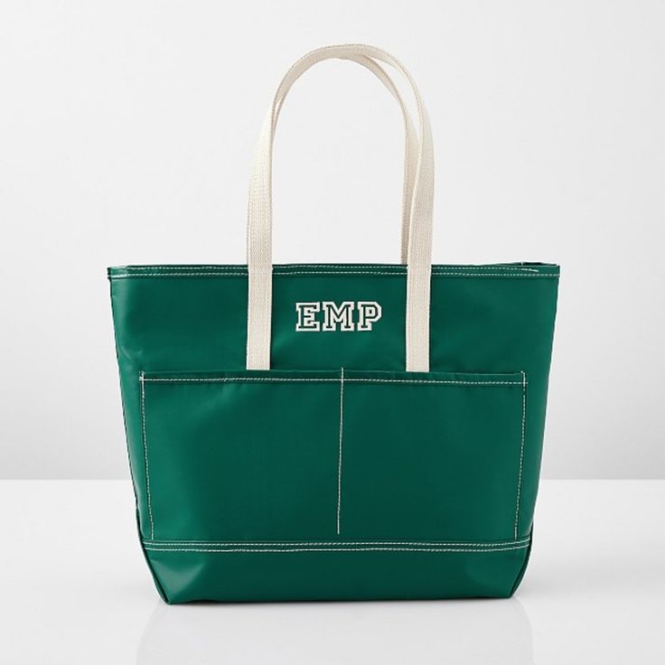 an emp green bag with white handles and two zippered pockets on the front