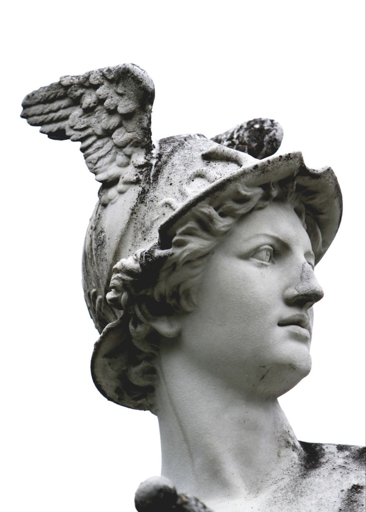 an angel statue wearing a hat on top of it's head