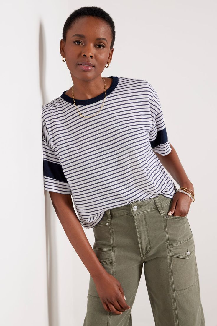 Elevate your everyday tee collection with this striped top from Sundry, featuring a crew neckline, color-blocked short sleeves, and a relaxed fit. Pair with cargo pants and a sandal for a put-together look. | SUNDRY Women's Stripe Blocked T-Shirt, Size Large, White Trendy Relaxed Fit T-shirt With Contrast Stripes, Sporty Tops With Striped Hem And Relaxed Fit, Sporty Relaxed Fit Top With Striped Hem, Casual Crew Neck T-shirt With Striped Sleeves, Casual T-shirt With Contrast Stripes, Relaxed Fit, Casual Striped Sleeve Crew Neck T-shirt, Summer Crew Neck T-shirt With Striped Sleeves, Casual T-shirt With Striped Hem And Crew Neck, Casual Crew Neck T-shirt With Striped Hem