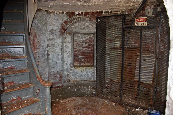 an old run down building with some stairs