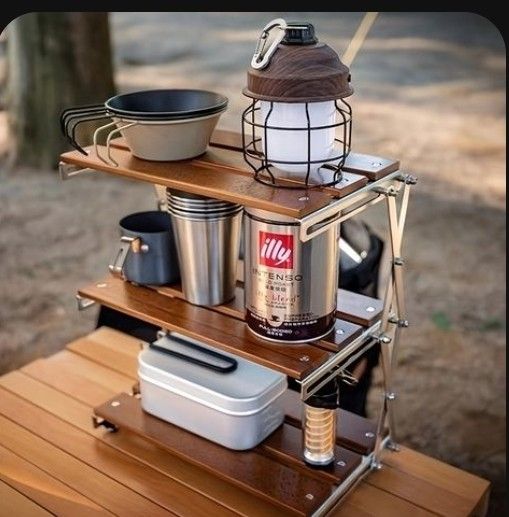 an outdoor cooking station with pots and pans on it