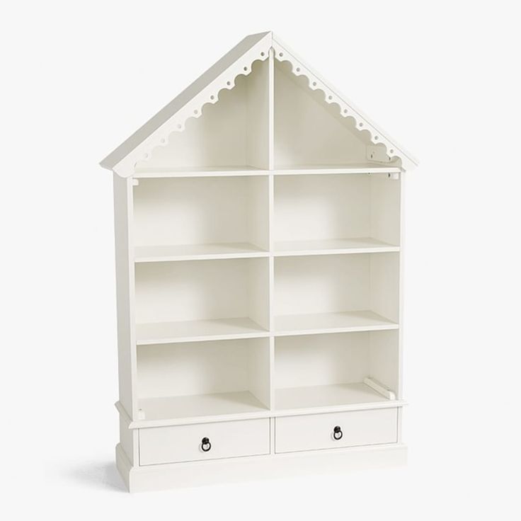 The cutest way to display her books or toys is within the cozy walls of our dollhouse shelving. HOW IT IS CONSTRUCTED Expertly crafted of MDF (medium density fiberboard). Our exclusive Simply White finish is applied by hand for exceptional richness, durability and depth of color. GREENGUARD Gold Certified to contribute to healthier indoor air, keeping you and your family safer. DETAILS THAT MATTER Features 8 roomy cubbies (including area under roof) and has two drawers. Hardware is finished in d Pottery Barn Bookcase, Campaign Style Furniture, Dollhouse Bookcase, Glamorous Furniture, Kids Doll House, Big Kids Room, Simply White, Bookshelves Kids, Baby Furniture