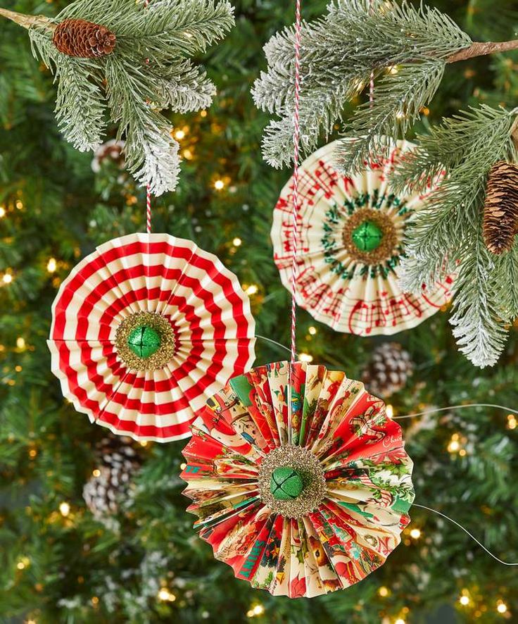 three ornaments hanging from a christmas tree