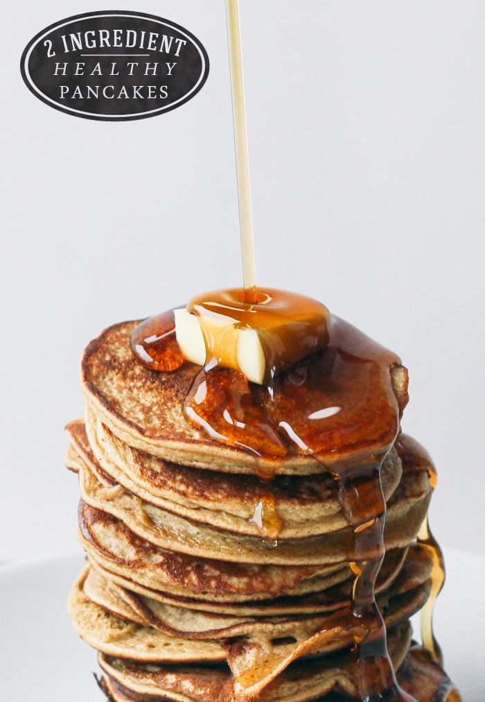 a stack of pancakes with syrup on top and a stick sticking out of the top