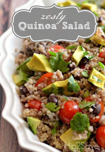 quinoa salad with avocado and tomatoes in a white bowl