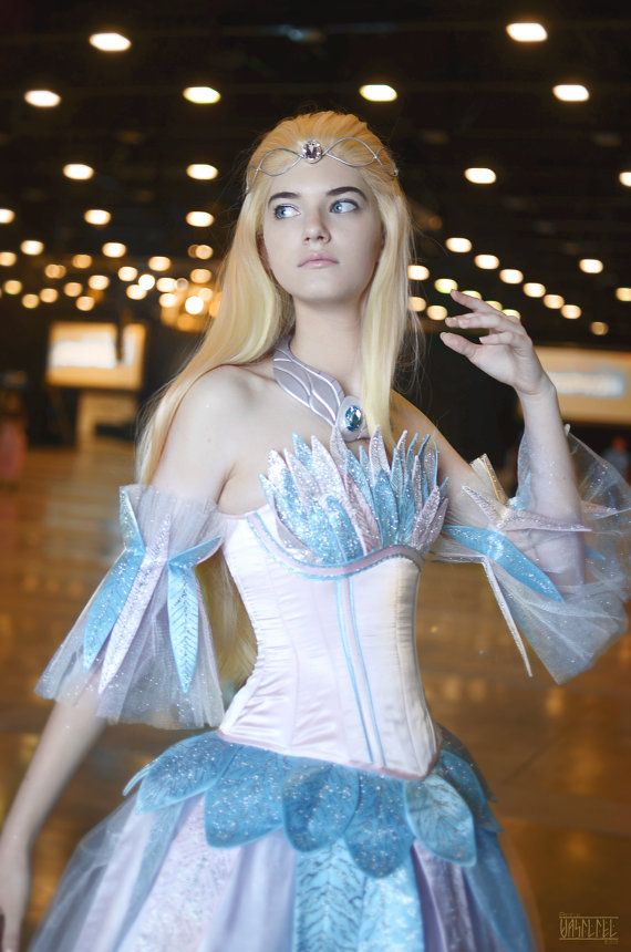 a woman in a white and blue costume