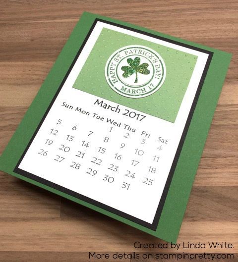 a green and white calendar on a wooden table